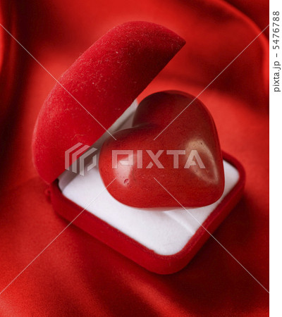 Valentine concept. Red velvet Gift Box with a heart Valentine concept. Red velvet Gift Box with a heart 5476788