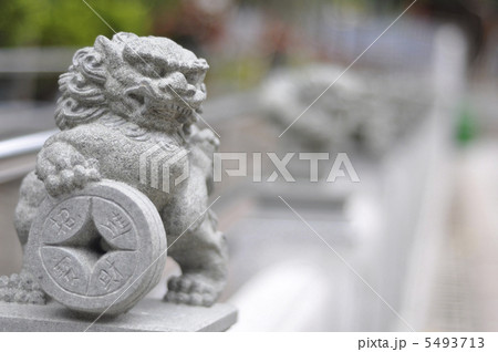 Chinese lion deity with old coin 5493713