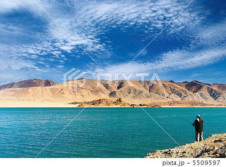 Fishing on mountain lake Fishing on mountain lake 5509597