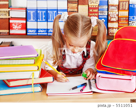 Child with stack book. 5511051