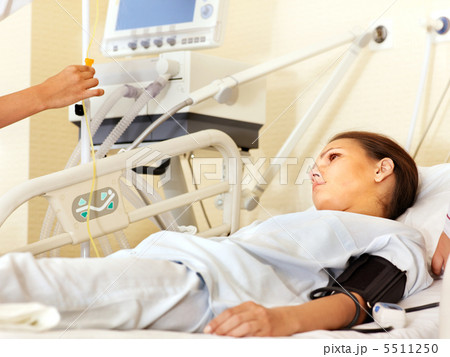 Woman on gurney in operating room. Woman on gurney in operating room. 5511250