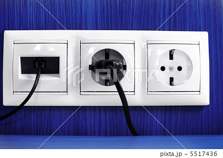Plugs in electric and phone  socket. 5517436