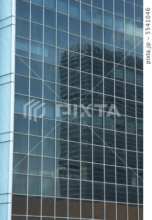reflection in the windows of office building 5541046