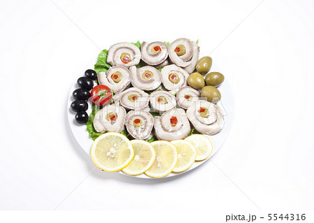 fish slices served with tomato and olives, and lemon fish slices served with tomato and olives, and lemon 5544316
