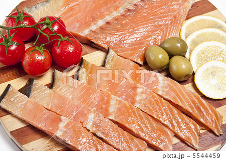 close-up of smoked salmon on wooden plate close-up of smoked salmon on wooden plate 5544459