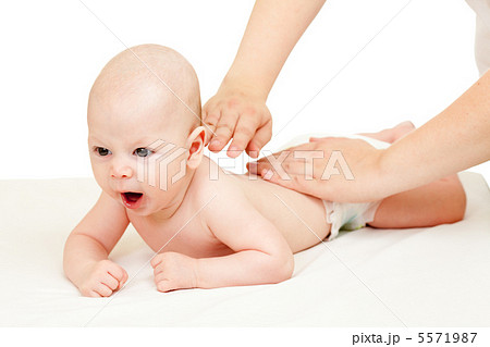 mother massaging her baby boy mother massaging her baby boy 5571987