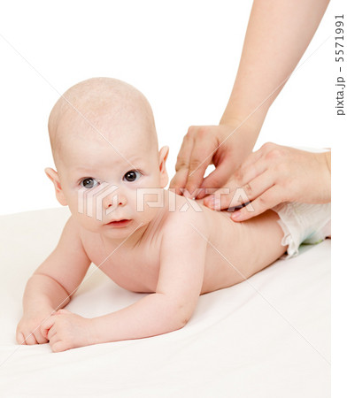 mother massaging her baby boy mother massaging her baby boy 5571991