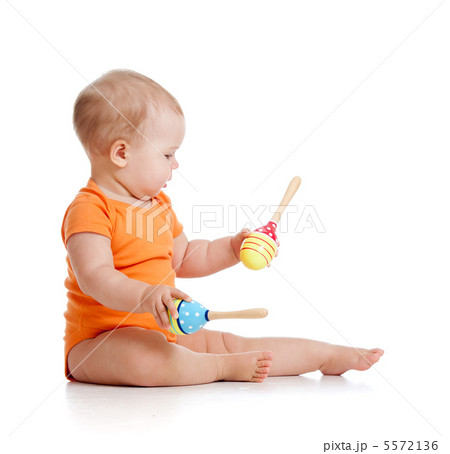 baby playing with musical toy 5572136
