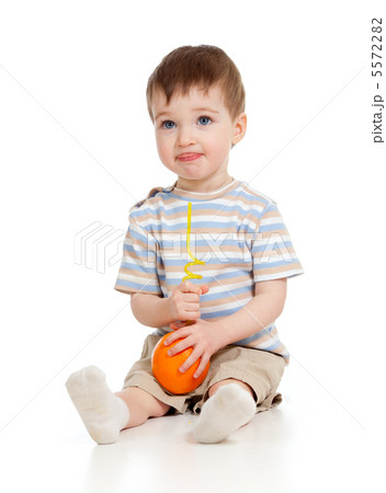 funny child eating fruits over white background 5572282