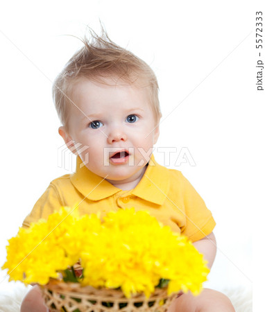 cute baby boy holding basket with yellow flowers cute baby boy holding basket with yellow flowers 5572333