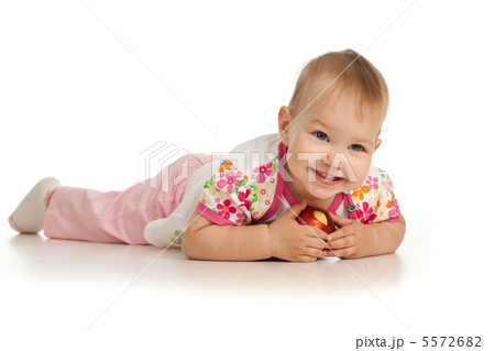 lying baby girl with red apple lying baby girl with red apple 5572682