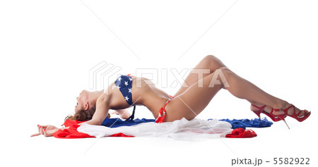 Smiling young woman in bikini with fabric Smiling young woman in bikini with fabric 5582922
