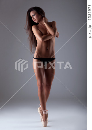 Young beautiful woman posing topless on tiptoe Young beautiful woman posing topless on tiptoe 5582973