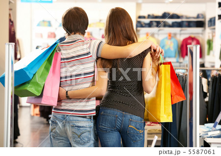 Backs of shoppers 5587061
