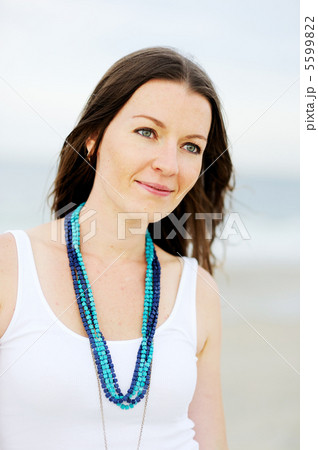 Portrait of beautiful brunette woman in white tank 5599822