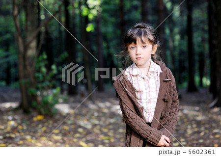 Portrait of adorable child girl in autumn forest Portrait of adorable child girl in autumn forest 5602361