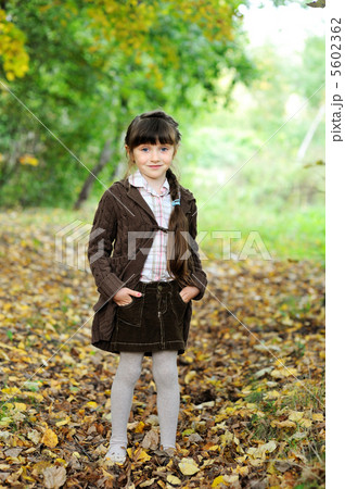 Portrait of adorable child girl in autumn forest Portrait of adorable child girl in autumn forest 5602362