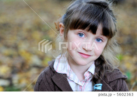 Portrait of adorable child girl in autumn forest 5602363