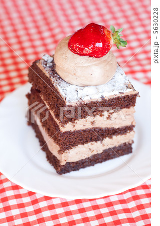 beautiful cake with strawberry on plaid fabric beautiful cake with strawberry on plaid fabric 5630228