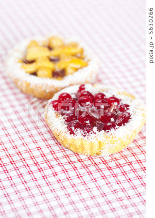 beautiful cake with berries on plaid fabric beautiful cake with berries on plaid fabric 5630266