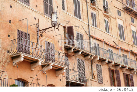 Wall with traditional balconies in Sienna, Italy Wall with traditional balconies in Sienna, Italy 5630418