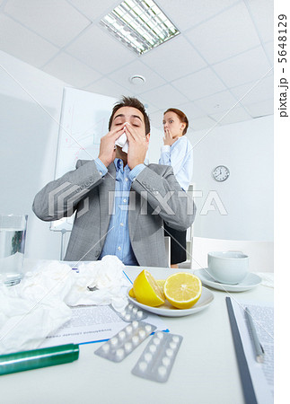 Man sneezing Man sneezing 5648129