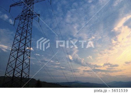 Sunset in mountains and electrified track 5651539