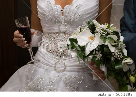 Bride hold bouquet and wine 5651898