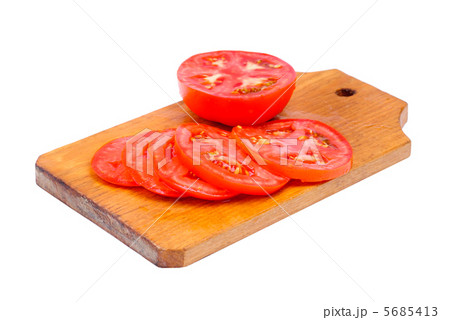 whole and sliced fresh red tomatoes on  cutting board isolated on white background 5685413