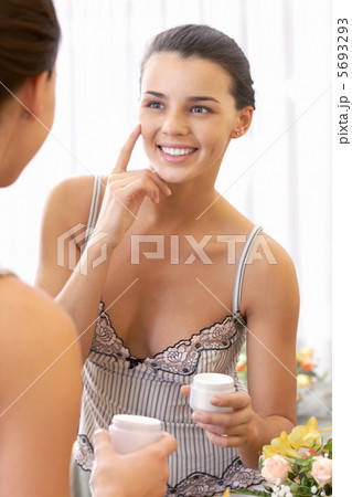 Applying cream 5693293
