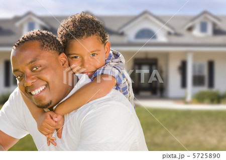 Mixed Race Father and Son In Front of House Mixed Race Father and Son In Front of House 5725890