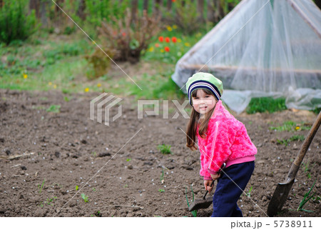 The little girl works in the garden The little girl works in the garden 5738911