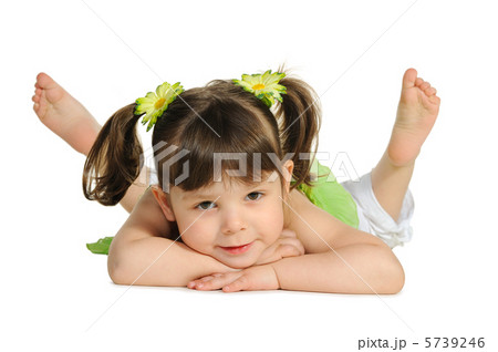 Pretty the little girl lies on the white Pretty the little girl lies on the white 5739246