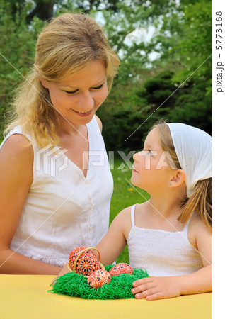 Young mother and daughter having Easter time Young mother and daughter having Easter time 5773188