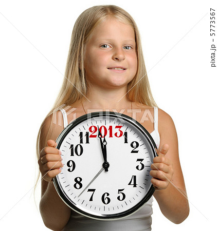 The girl hold in hands a big clock with figures 2013 5773567
