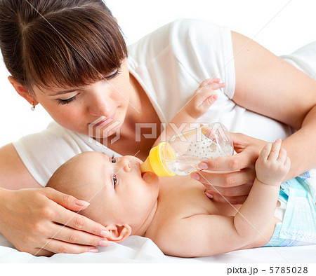 young mother feeding her adorable baby 5785028