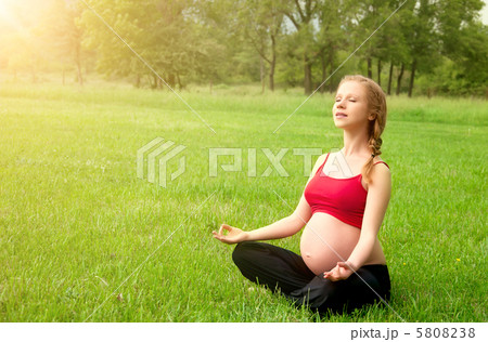 pregnant woman meditating in nature, practice yoga pregnant woman meditating in nature, practice yoga 5808238