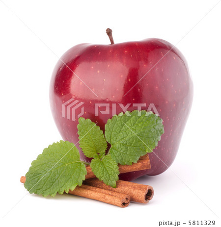 Red apple, cinnamon sticks and mint leaves still life 5811329