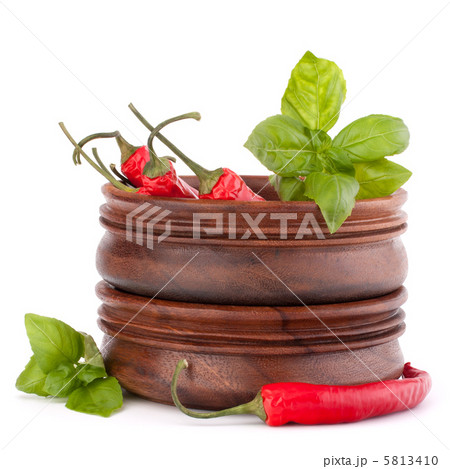 Hot red chili or chilli pepper in wooden bowls stack Hot red chili or chilli pepper in wooden bowls stack 5813410