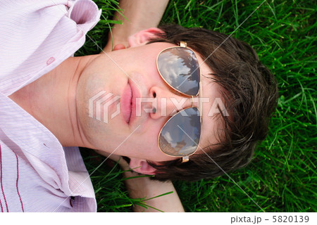 Man lie on the grass 5820139