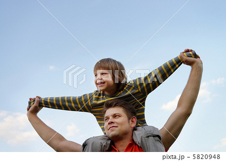 Happy son on the shoulders of the father Happy son on the shoulders of the father 5820948