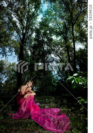 Fairy tale - fancy woman in dramatic pose, red dress 5839610