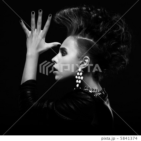 Strange stylish punk woman saluting and gesturing 5841374