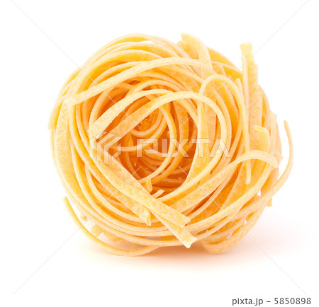 Italian pasta tagliatelle nest isolated on white background Italian pasta tagliatelle nest isolated on white background 5850898