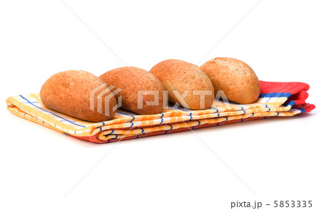 fresh warm rolls over kitchen towel isolated on white background fresh warm rolls over kitchen towel isolated on white background 5853335