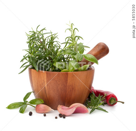 fresh flavoring herbs and spices in wooden mortar fresh flavoring herbs and spices in wooden mortar 5855030