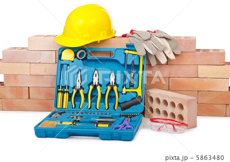 Construction concept with helmet and toolkit 5863480