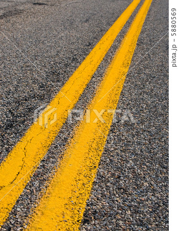 yellow dividing lines on the highway. yellow dividing lines on the highway. 5880569