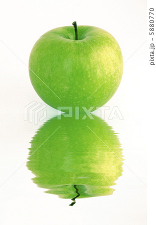 green apple reflecting in a water green apple reflecting in a water 5880770
