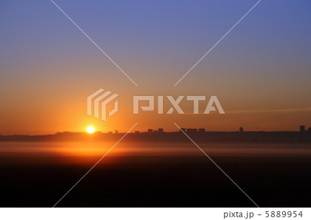sunrise over far town 5889954